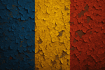 Close-up of the Romanian flag with vertical blue, yellow, and red stripes, painted on a textured surface with peeling, weathered paint.