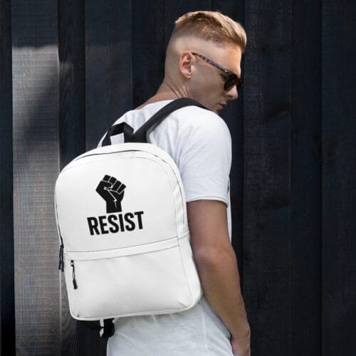 White backpack with raised fist and RESIST text worn by male model