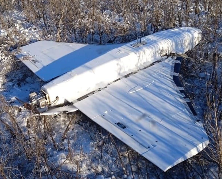 Downed Russian Gerbera drone lying in snow-covered field in Sumy region of Ukraine, January 2025.