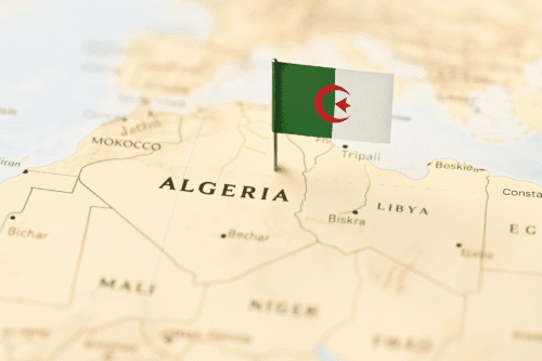 Map of Algeria with a small Algerian flag pinned into the northern part of the country.