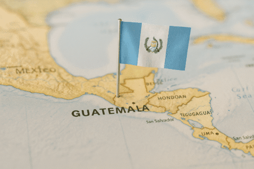 Map of Central America focused on Guatemala with the Guatemalan flag pinned into the territory.