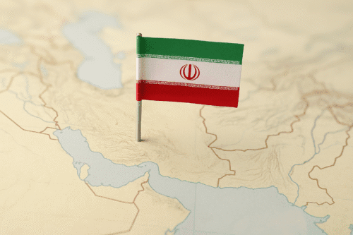 Map of Iran with a small Iranian flag pinned into the central part of the country.