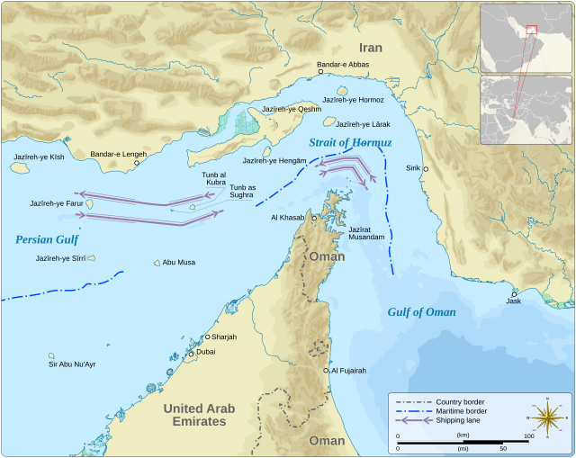 Map of the Strait of Hormuz showing the narrow waterway between Iran, Oman, and the United Arab Emirates with shipping lanes, maritime borders, and key islands including Qeshm and the Musandam Peninsula